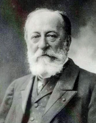 Ein Bild von Camille Saint-Saëns in hohem Alter und in schwarz-weiß.